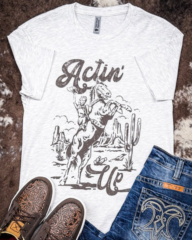 Actin' Up Graphic Tee displayed and styled on hide background.