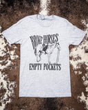Broke Horses Empty Pockets Graphic Tee displayed on hide background.