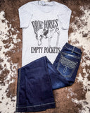 Broke Horses Empty Pockets Graphic Tee  displayed and styled on hide background.