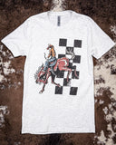Bucking Horse Graphic Tee displayed on hide background.