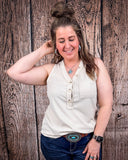The Lanie Tank in Oatmeal being styled with jeans and modeled on a women in front of wood backdrop.