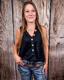 The Lanie Tank in black being styled and modeled by a women in front of wood background.