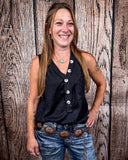 The Lanie Tank in black being styled and modeled by a women in front of wood background.