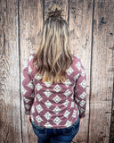 High Plains Aztec Top from the back styled with jeans and worn by a women in front of wood backdrop.