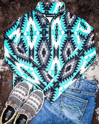 Aztec Everest Fitted Pullover displayed with jeans and shoes on cowhide.