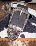 Andi Slip on Mule in Black Cow Print by Very G close up displayed on cowhide.