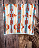 Pecos Towels displayed on rode in front of wood and wheat backdrop.