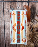 Pecos Towels displayed on rode in front of wood and wheat backdrop.