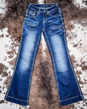 Honor Dark Trouser Jeans displayed on cowhide.