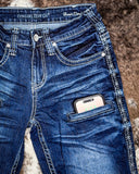 Close up of Honor Dark Trouser Jeans displayed on cowhide.