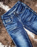 Close up of Honor Dark Trouser Jeans displayed on cowhide.
