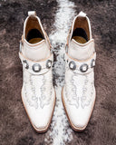 Top view of the Western Ember Booties in White displayed on cowhide.