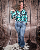 Steph High Waisted Trouser Flares being styled and modeled on a women in front of wood background.