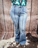 Steph High Waisted Trouser Flares being modeled on a women in front of wood background.