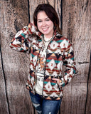 A model wearing the Southern Roots Soft Shell Jacket in a wooden backdrop.