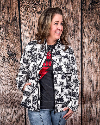 A model wearing the Life is a Rodeo Soft Shell Jacket with a wood backdrop.