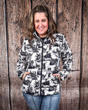 A model wearing the Life is a Rodeo Soft Shell Jacket with a wood backdrop.