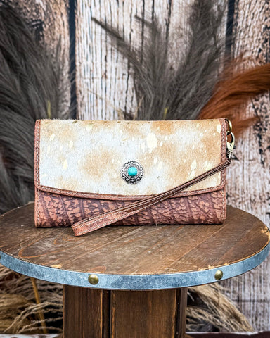 The Angelstone Wallet in Brown and White on a wooden table with wheat in the back, wood background.