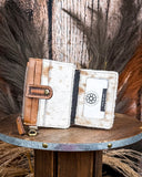 Inside of the Wildflowers of The Prairie Card Holder on a wooden table with wheat in the back.