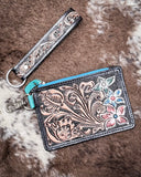 The Pride of Prickly Pears Card Holder in Black displayed on cowhide.