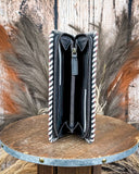 Inside of wallet with pattern on a wooden surface with a rustic background