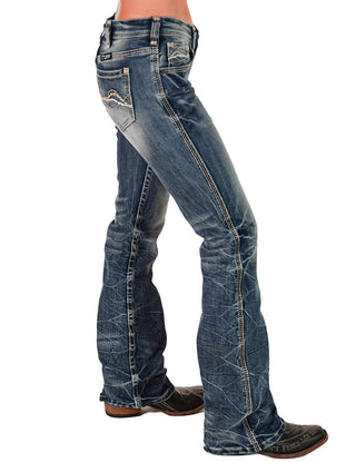 Blue jeans worn by a person on a white background