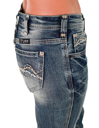 Blue jeans with a 'TUFF' label on a white background