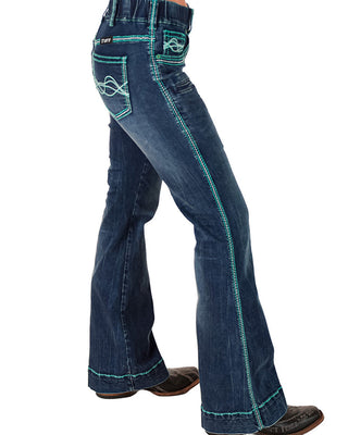Blue jeans with green stitching on a white background