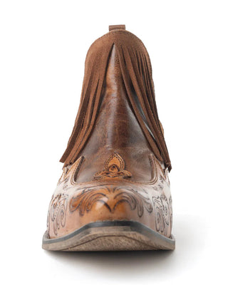 Brown leather boot with intricate designs on a white background