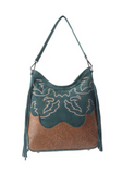 Green western suede purse with tooled leather bottom and detailed stitching on white background