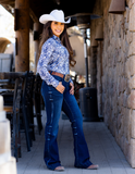 Model wearing jeans and rodeo top.