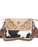 Front view of the Coral Paz Hand-Tooled Bag in a white back drop.