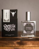 Soñora Perfume and box displayed on a wooden table.