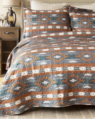 Wrangler Checotah Quilt Set laid out and displayed on bed.
