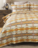 Wrangler Amarillo Sunset Quilt and pillows displayed in bedroom setting.