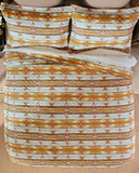 Wrangler Amarillo Sunset Quilt and pillows displayed in bedroom setting.