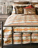 Wrangler Amarillo Sunset Quilt and pillows displayed in bedroom setting.