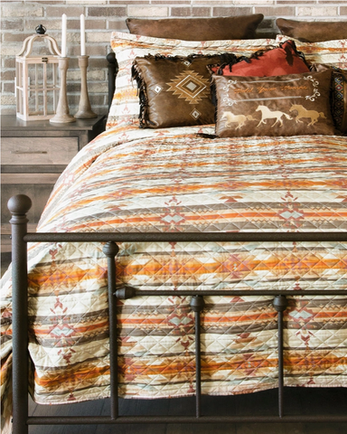 Wrangler Amarillo Sunset Quilt and pillows displayed in bedroom setting.