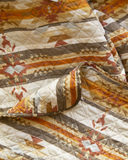 Close up of Wrangler Amarillo Sunset Quilt and pillows pattern