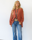 The Stillwater Tunic Top in color Rust being styled and modeled on women.