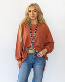The Stillwater Tunic Top in color Rust being styled and modeled on women.