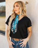 The Thatcher Top in black being styled and worn by women in front of white background.