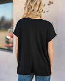 The Thatcher Top in black being styled and worn by women in front of white background.