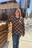 The Palmer Pullover being styled and modeled by women outside.