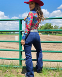 Tuff Sport Bootcut Jeans styled and modeled on a women in farm setting.