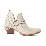 Side view of the Western Ember Booties in White in a white backdrop.