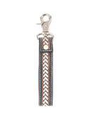 Leather keychain with braided design on a white background