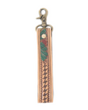 Leather key fob with intricate designs on a white background