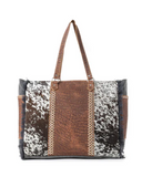 Multicolored patterned handbag with brown handle on a white background