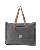 Gray tote bag with brown leather accents on a white background
